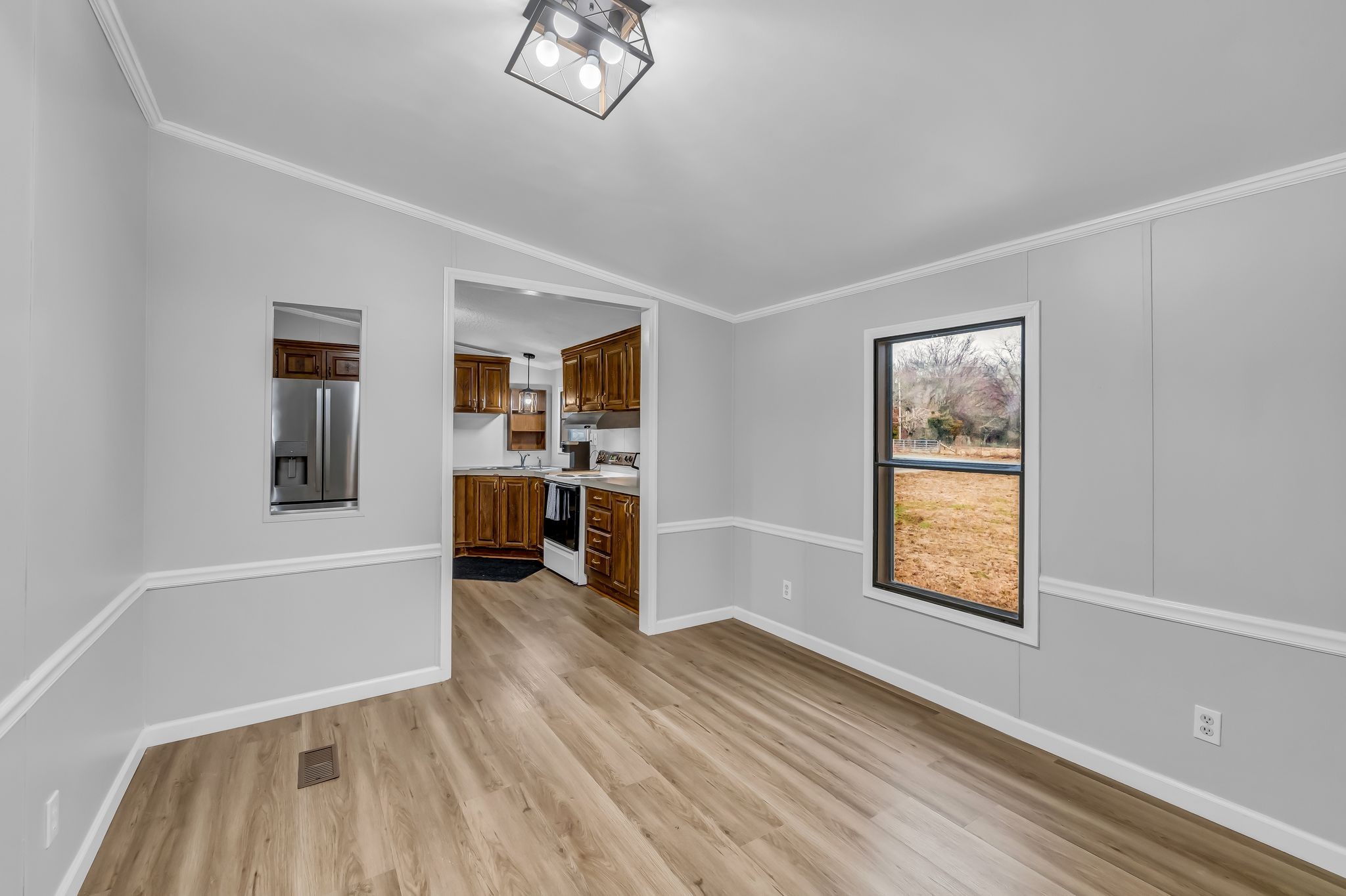 830 Calls Road Estill Springs, TN 37330 - Photo 20 of 35 a view of a hardwood floor and a window in a room
