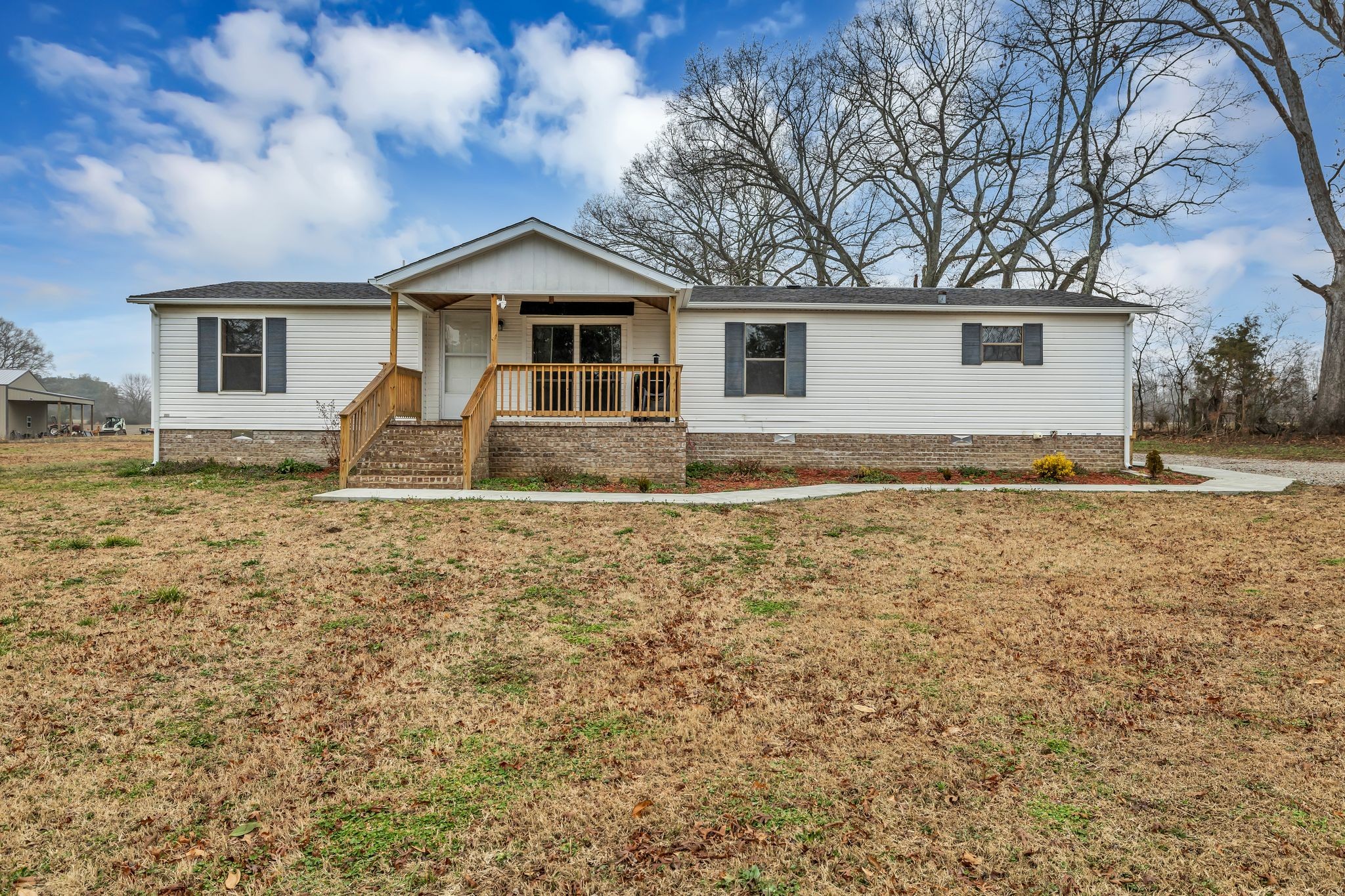 830 Calls Road Estill Springs, TN 37330 - Photo 2 of 35 a front view of a house with garden