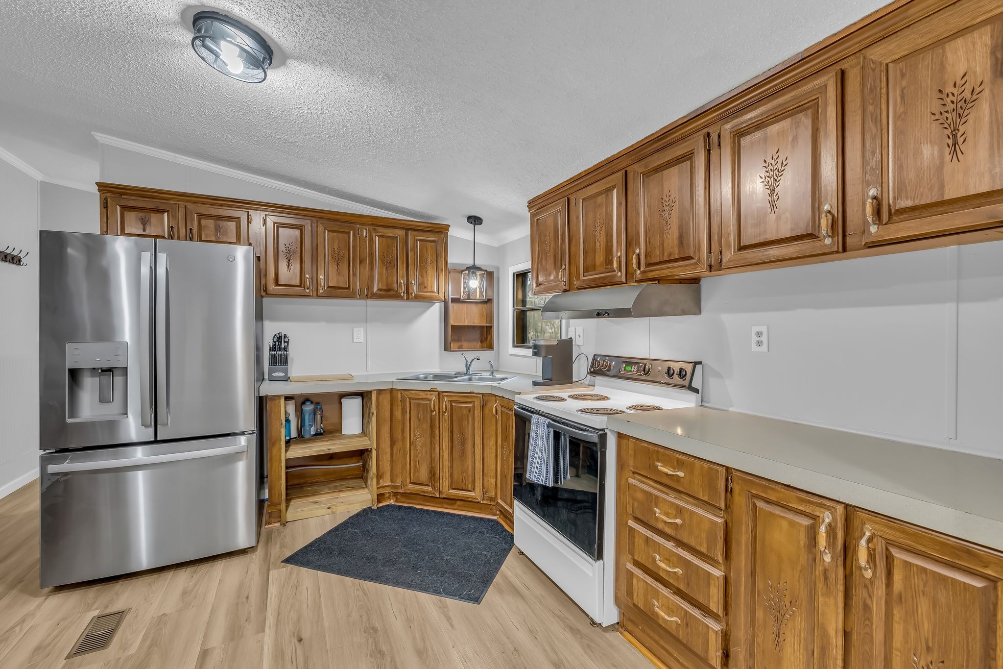 830 Calls Road Estill Springs, TN 37330 - Photo 22 of 35 a kitchen with stainless steel appliances granite countertop a refrigerator stove and sink