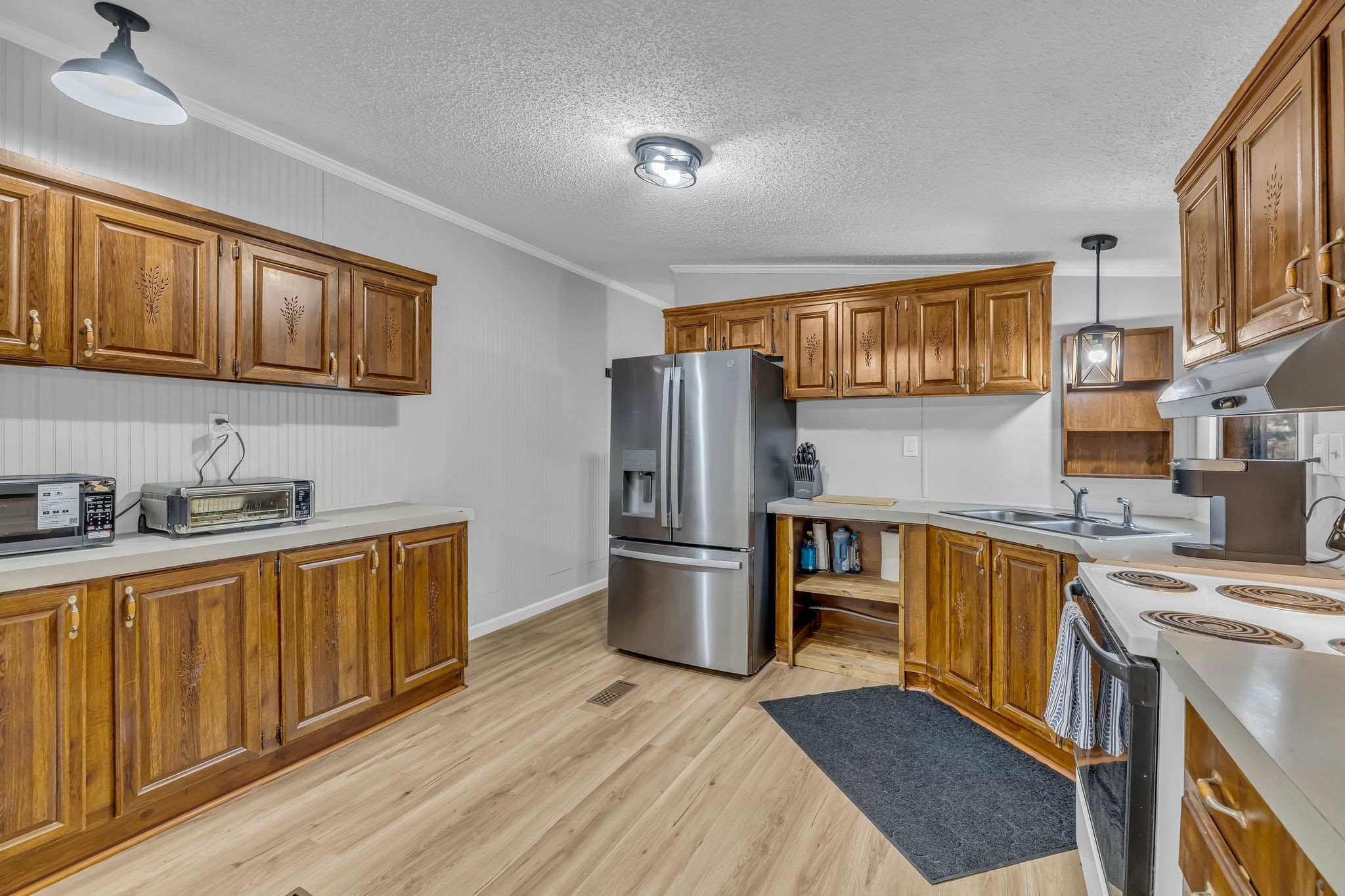 830 Calls Road Estill Springs, TN 37330 - Photo 23 of 35 a kitchen with a stove sink and refrigerator
