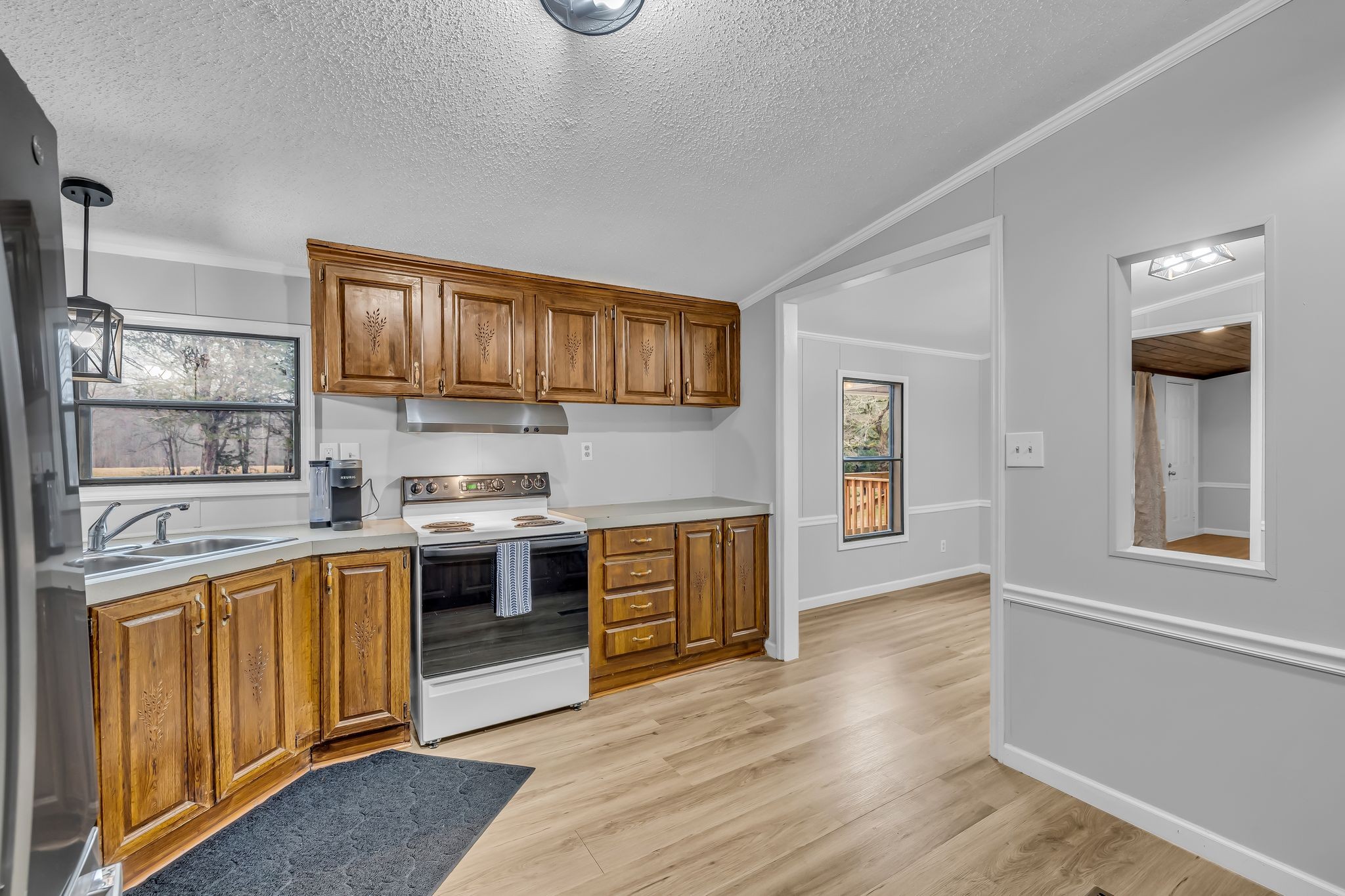 830 Calls Road Estill Springs, TN 37330 - Photo 24 of 35 a kitchen with stainless steel appliances granite countertop a stove and cabinets
