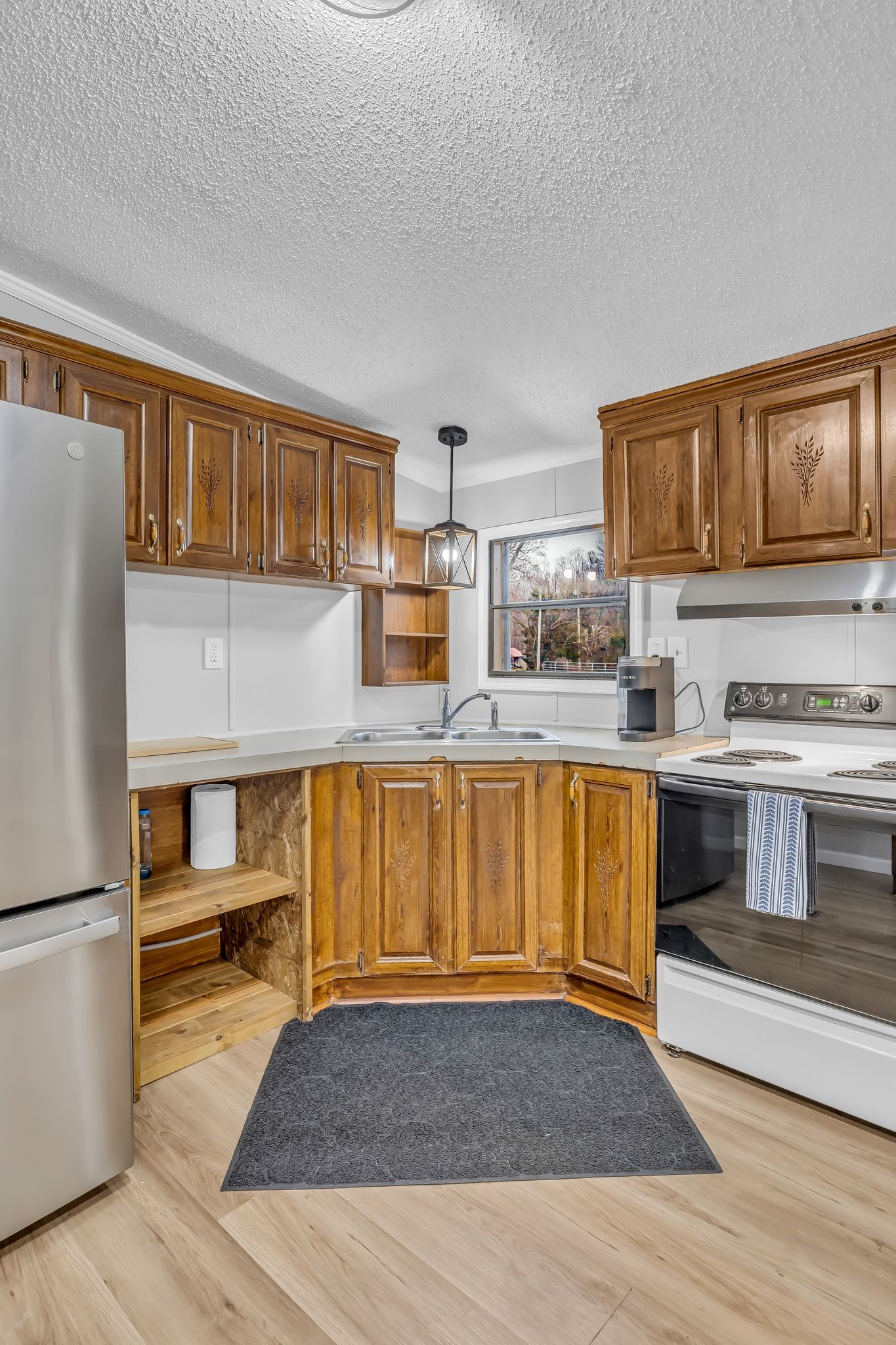 830 Calls Road Estill Springs, TN 37330 - Photo 25 of 35 a kitchen with granite countertop a stove and cabinets