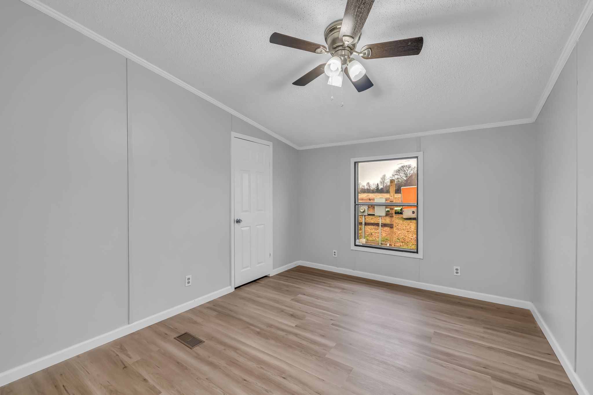 830 Calls Road Estill Springs, TN 37330 - Photo 27 of 35 wooden floor in an empty room with a window