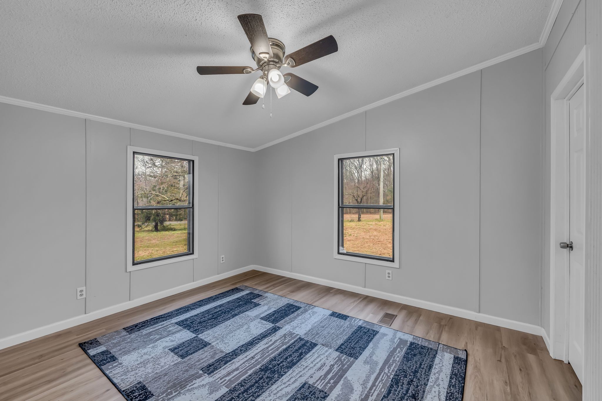 830 Calls Road Estill Springs, TN 37330 - Photo 30 of 35 a view of an empty room with wooden floor and a window