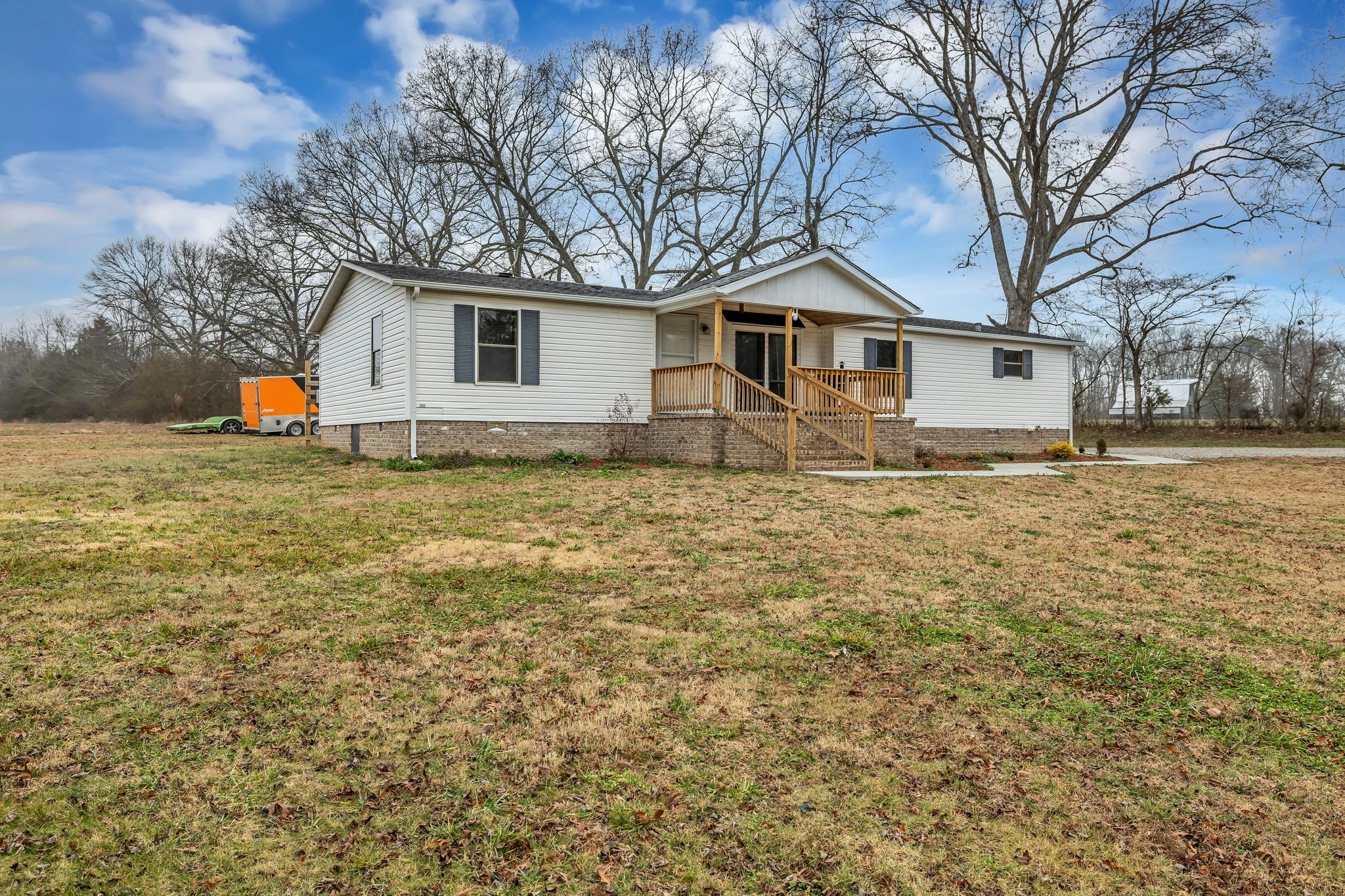 830 Calls Road Estill Springs, TN 37330 - Photo 3 of 35 a house with trees in the background