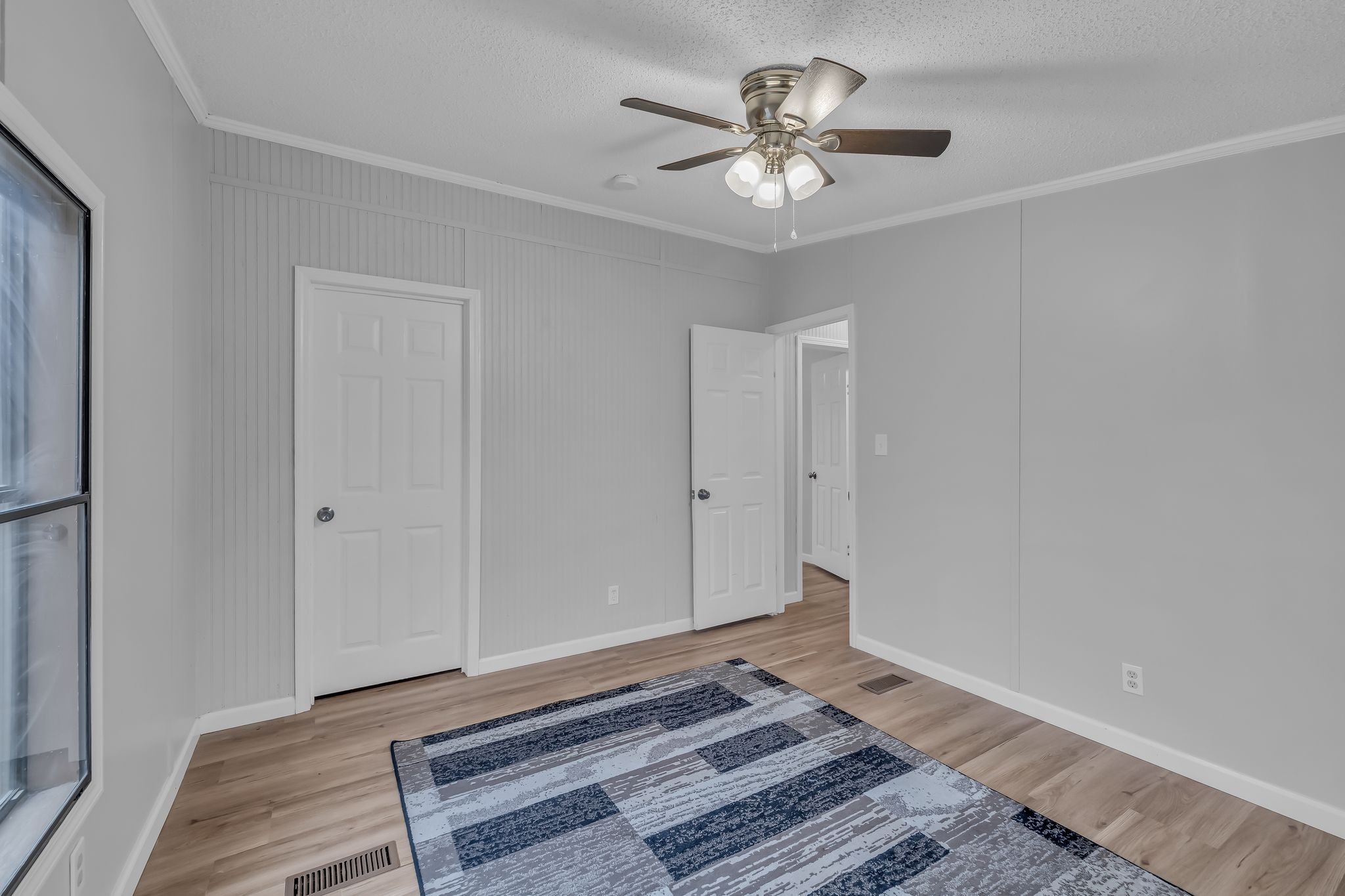 830 Calls Road Estill Springs, TN 37330 - Photo 31 of 35 a view of a room with wooden floor and a ceiling fan
