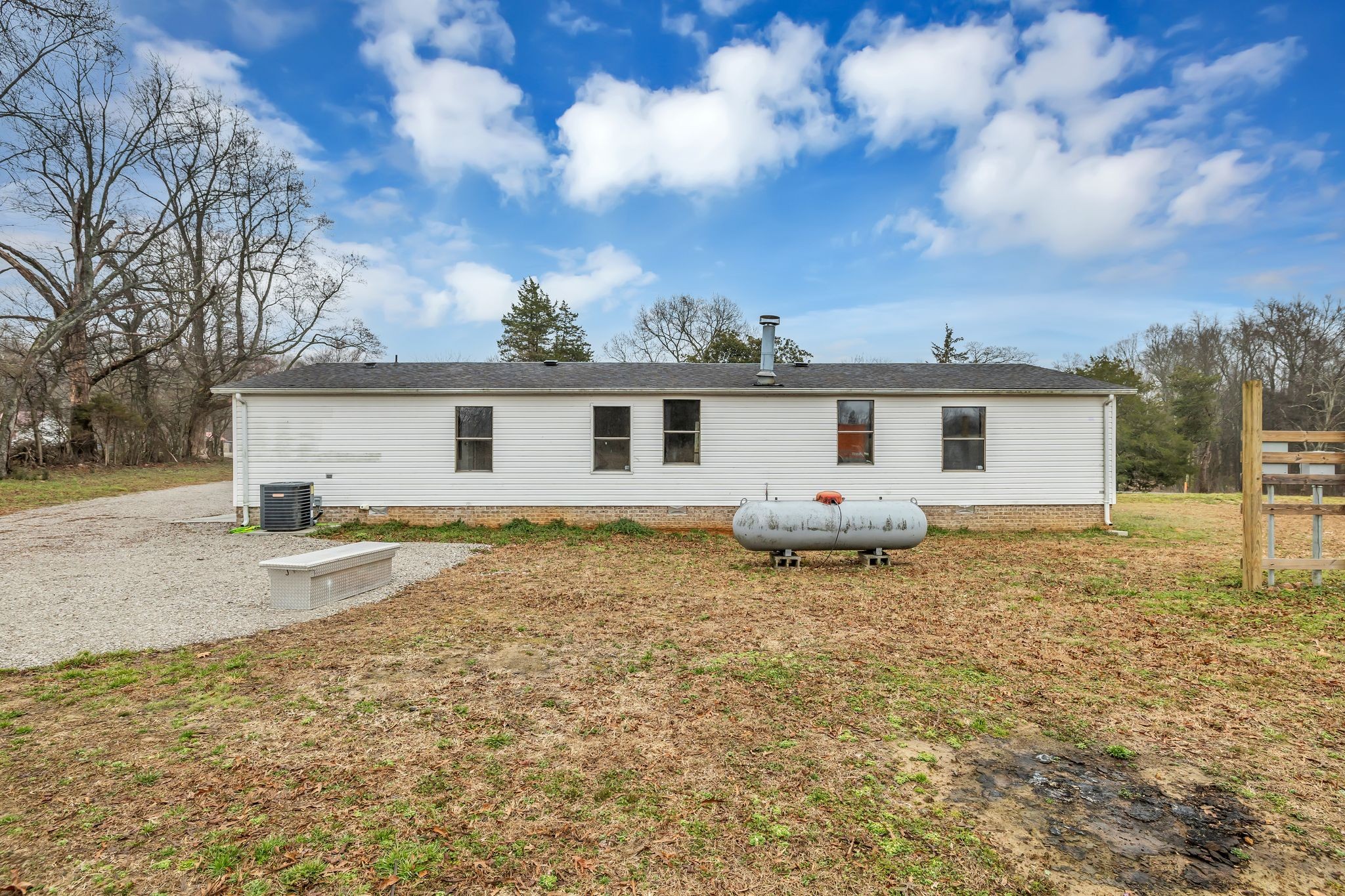 830 Calls Road Estill Springs, TN 37330 - Photo 32 of 35 a view of a house with a backyard and a tree