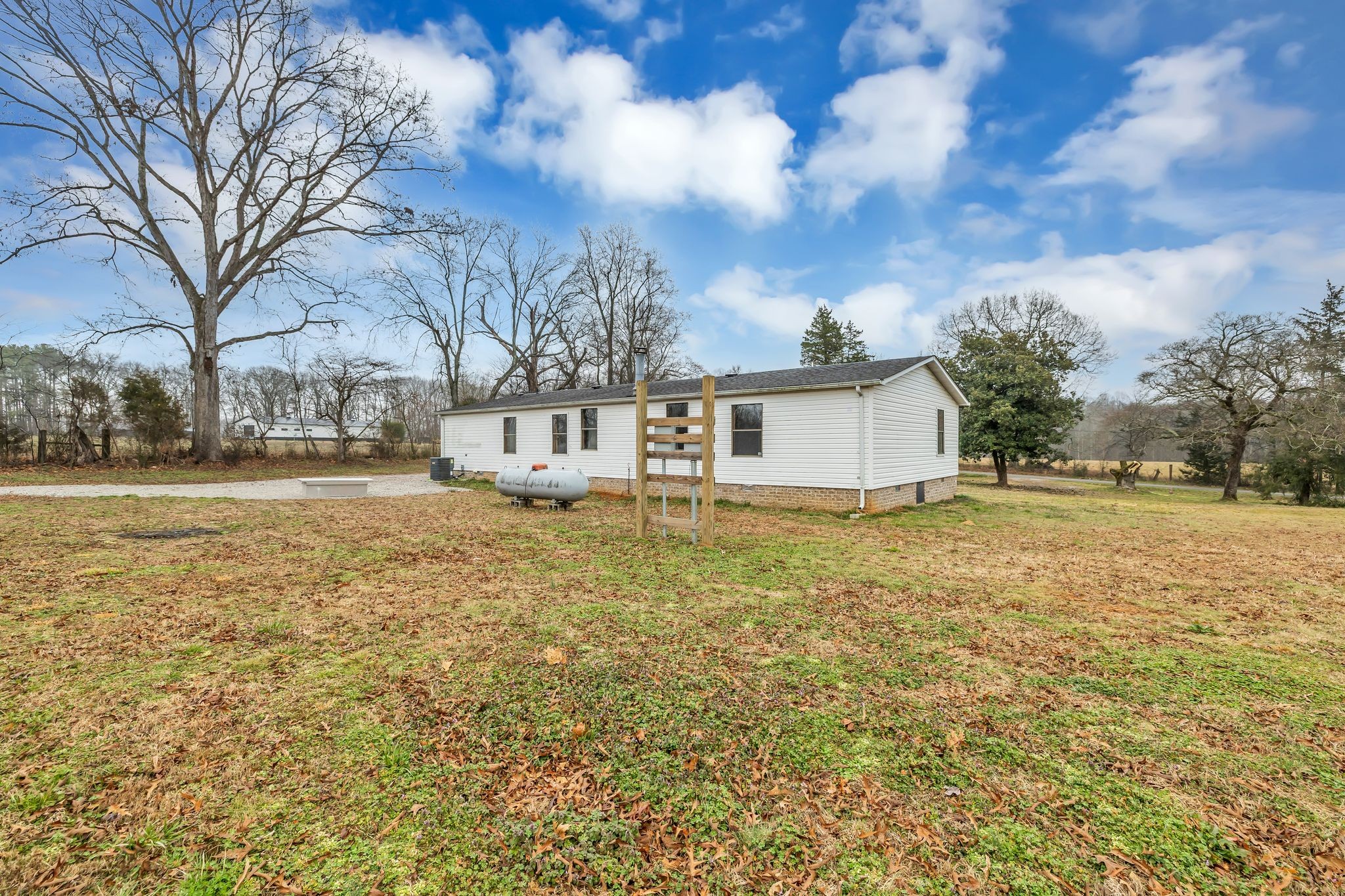 830 Calls Road Estill Springs, TN 37330 - Photo 33 of 35 a front view of house with yard and trees