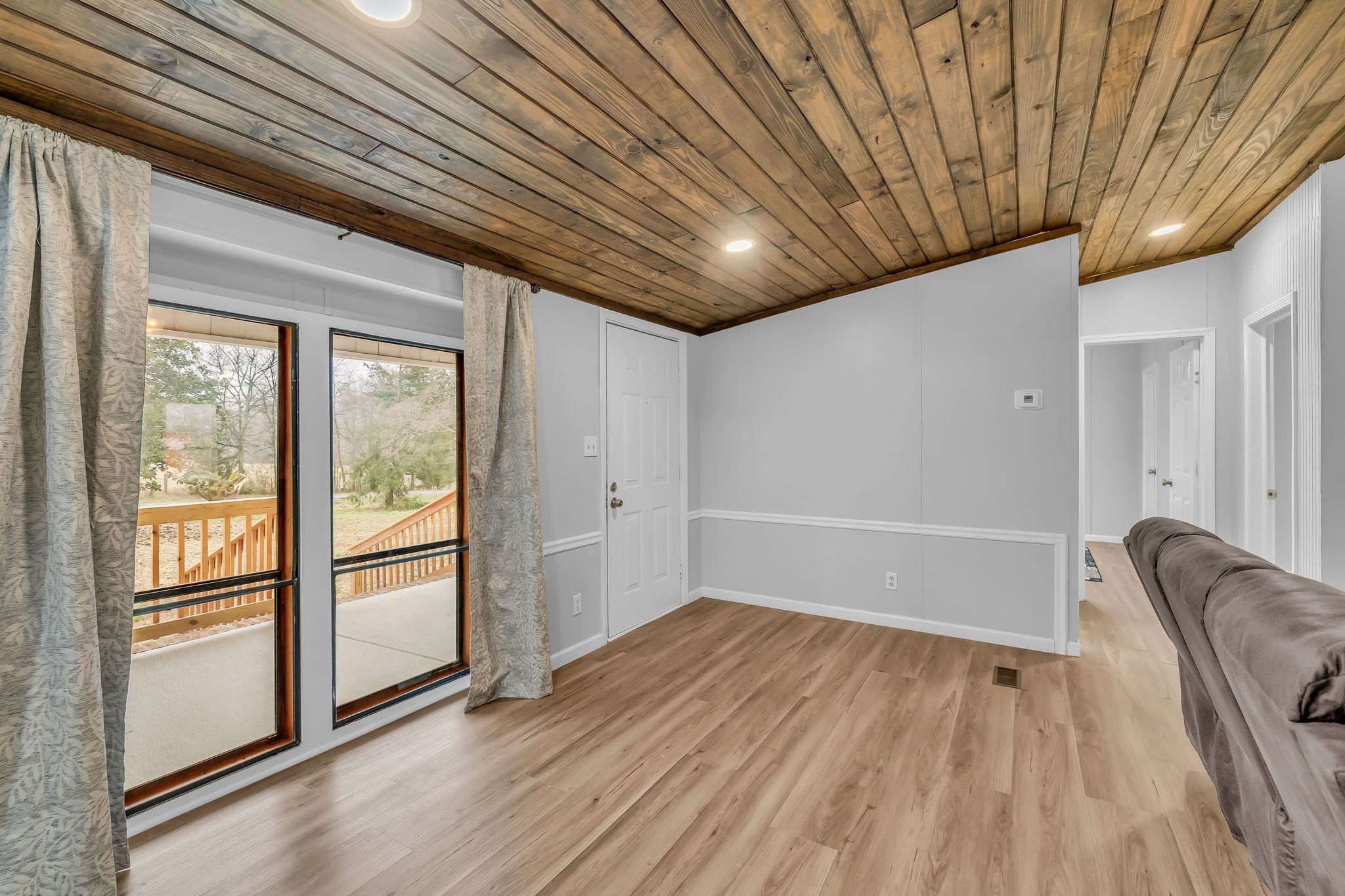 830 Calls Road Estill Springs, TN 37330 - Photo 8 of 35 an empty room with wooden floor and windows