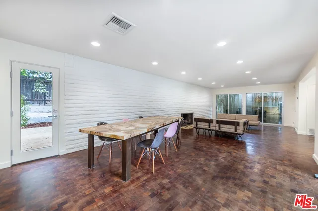 a kitchen with a table and chairs in it