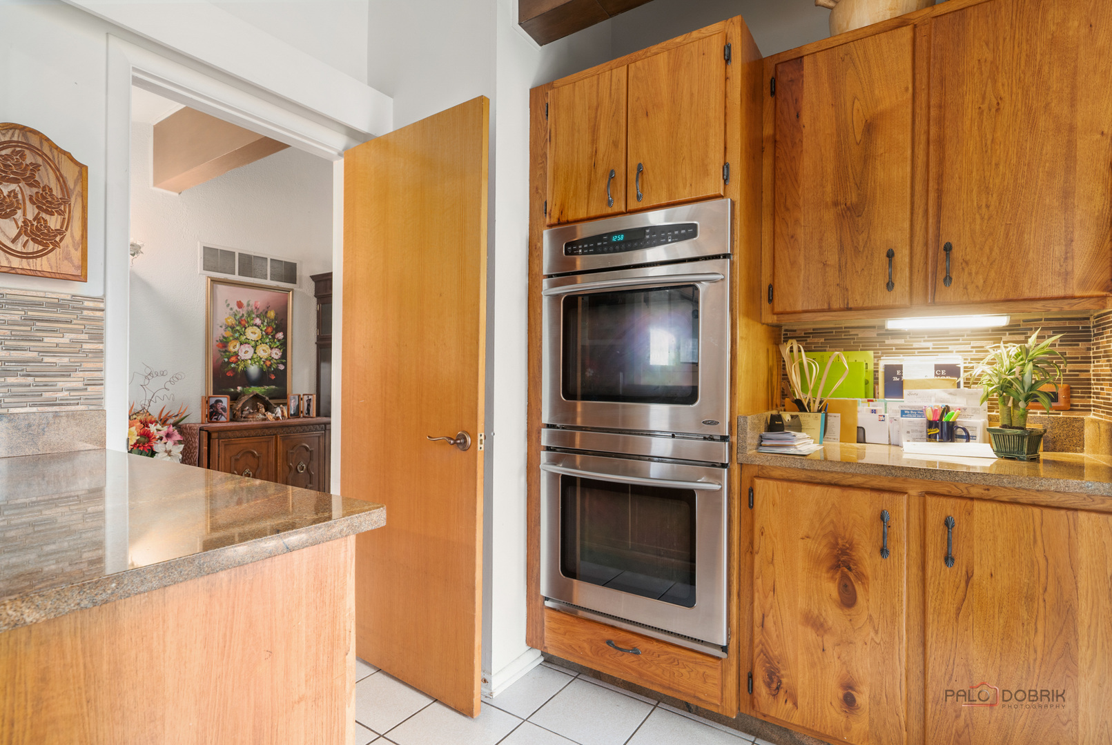 1161 Oak Spring Lane Libertyville, IL 60048 - Photo 10 of 30 a kitchen with stainless steel appliances granite countertop a refrigerator a stove and a sink with wooden floor