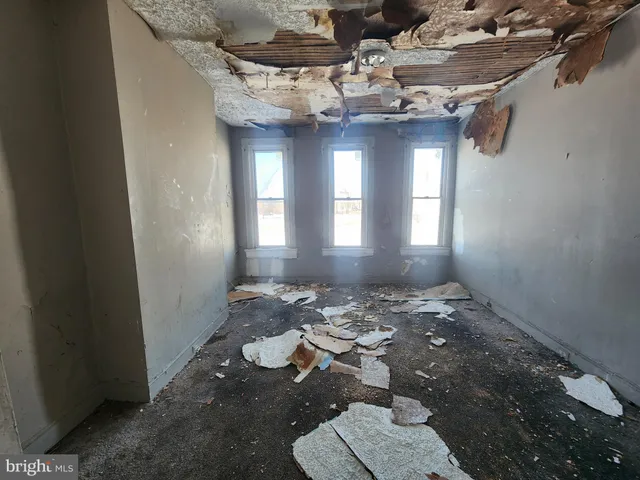 a view of a livingroom with furniture and window