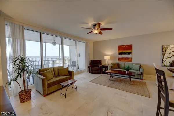 a living room with furniture and a large window