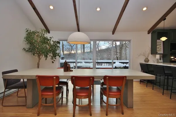 a dining table with chairs and a coffee table
