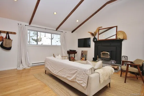 a bedroom with furniture and a fireplace