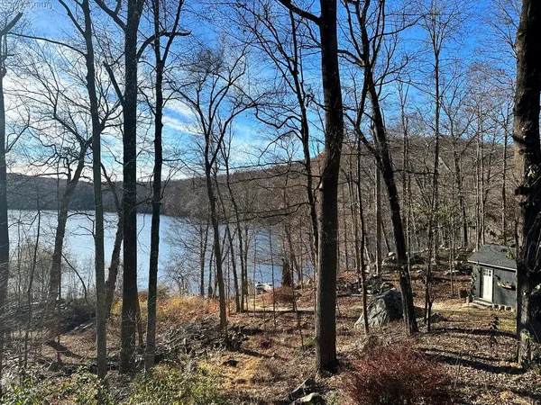 a view of balcony with wooden floor and seating space