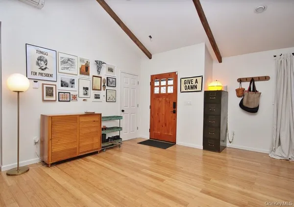 a view of a livingroom with furniture and natural light