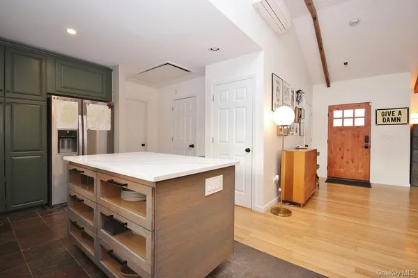 a kitchen that has a lot of cabinets in it