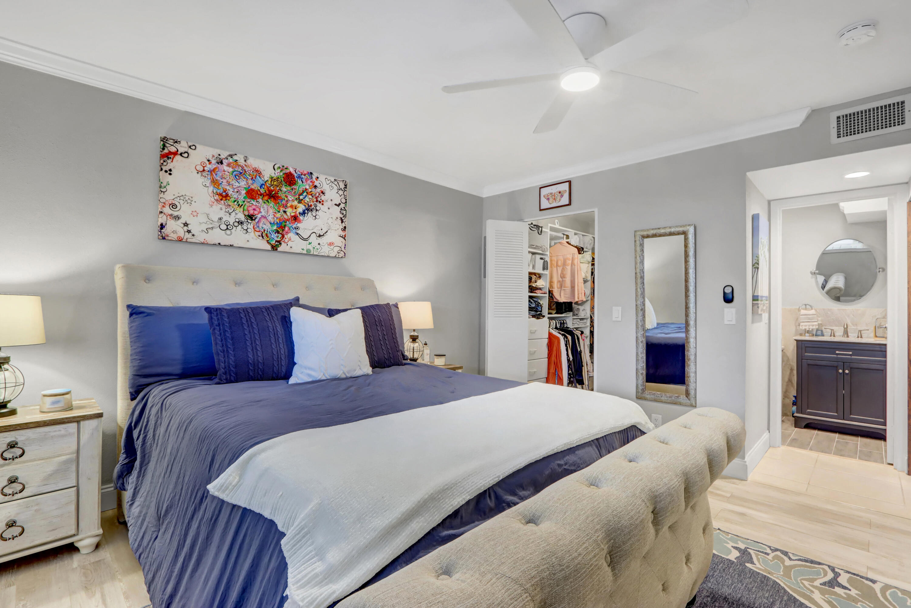 508 Monaco Way Delray Beach, FL 33446 - Photo 11 of 36 a bedroom with a large bed and a chandelier