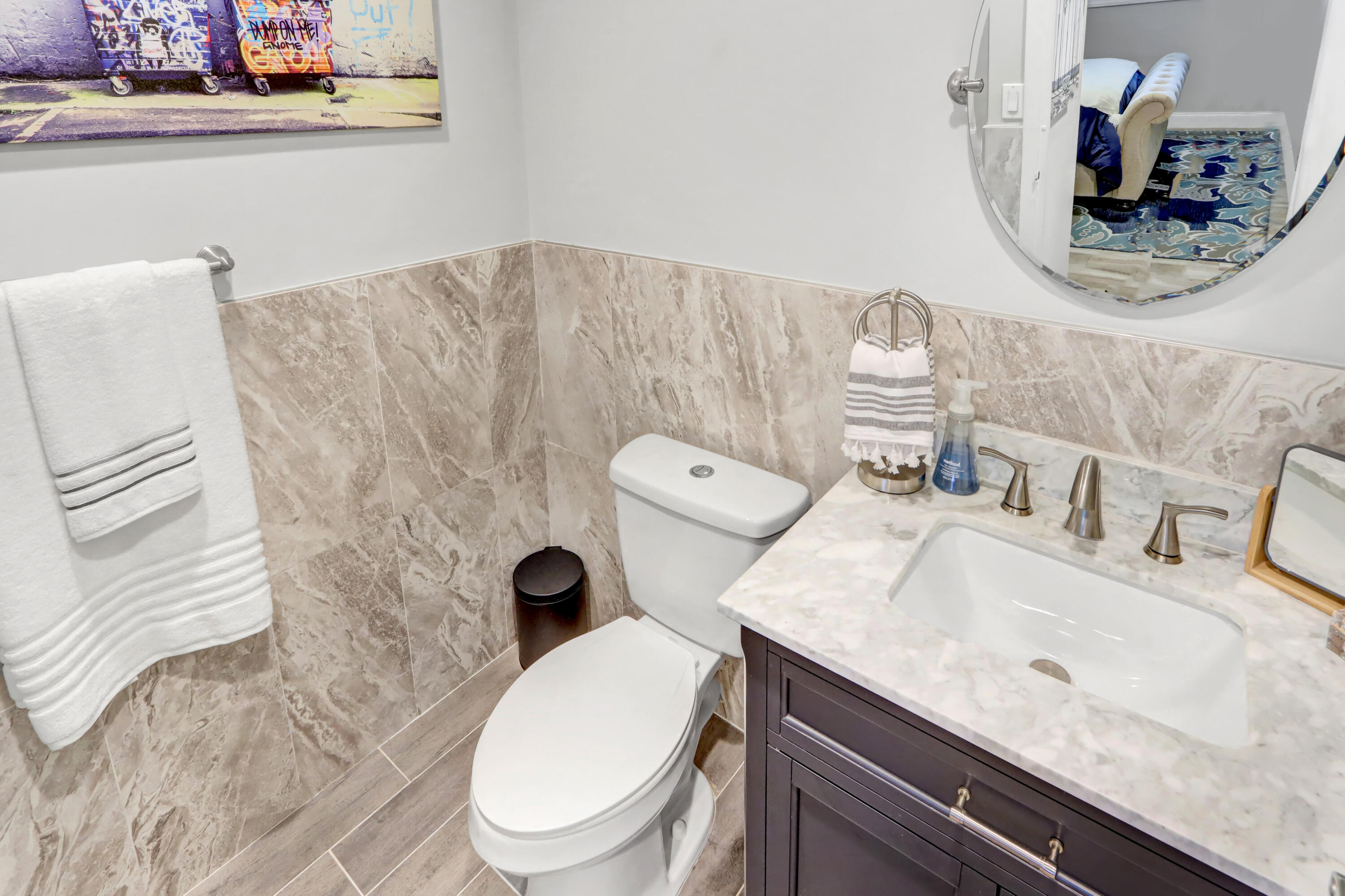 508 Monaco Way Delray Beach, FL 33446 - Photo 13 of 36 a bathroom with a granite countertop toilet sink and mirror
