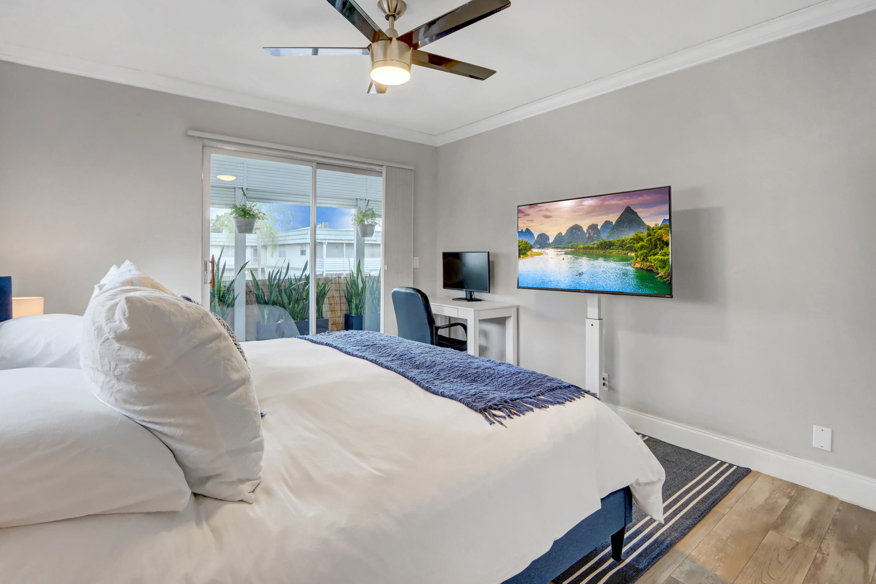 508 Monaco Way Delray Beach, FL 33446 - Photo 17 of 36 a bedroom with a bed and a flat screen tv
