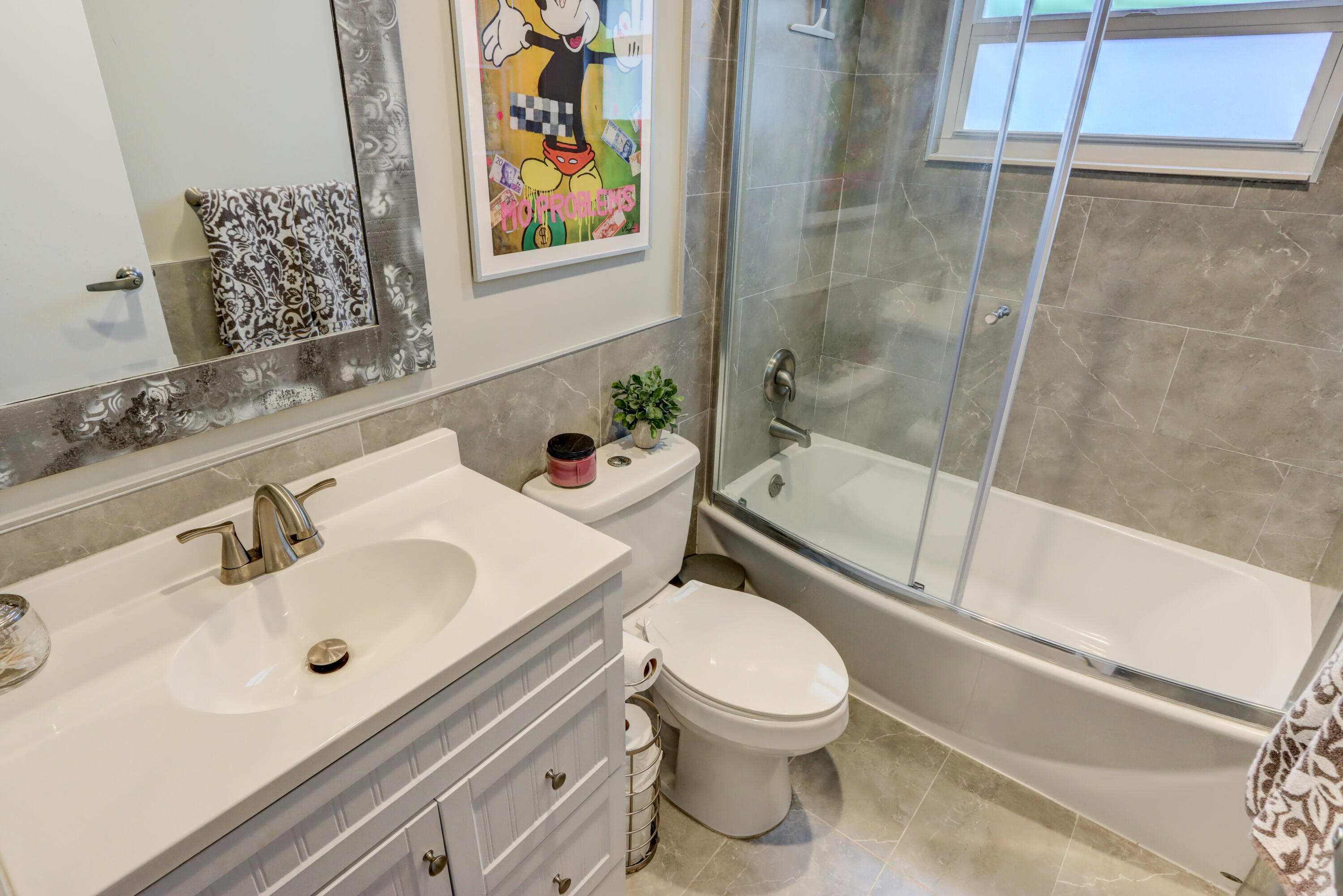 508 Monaco Way Delray Beach, FL 33446 - Photo 19 of 36 a bathroom with a sink mirror vanity and toilet