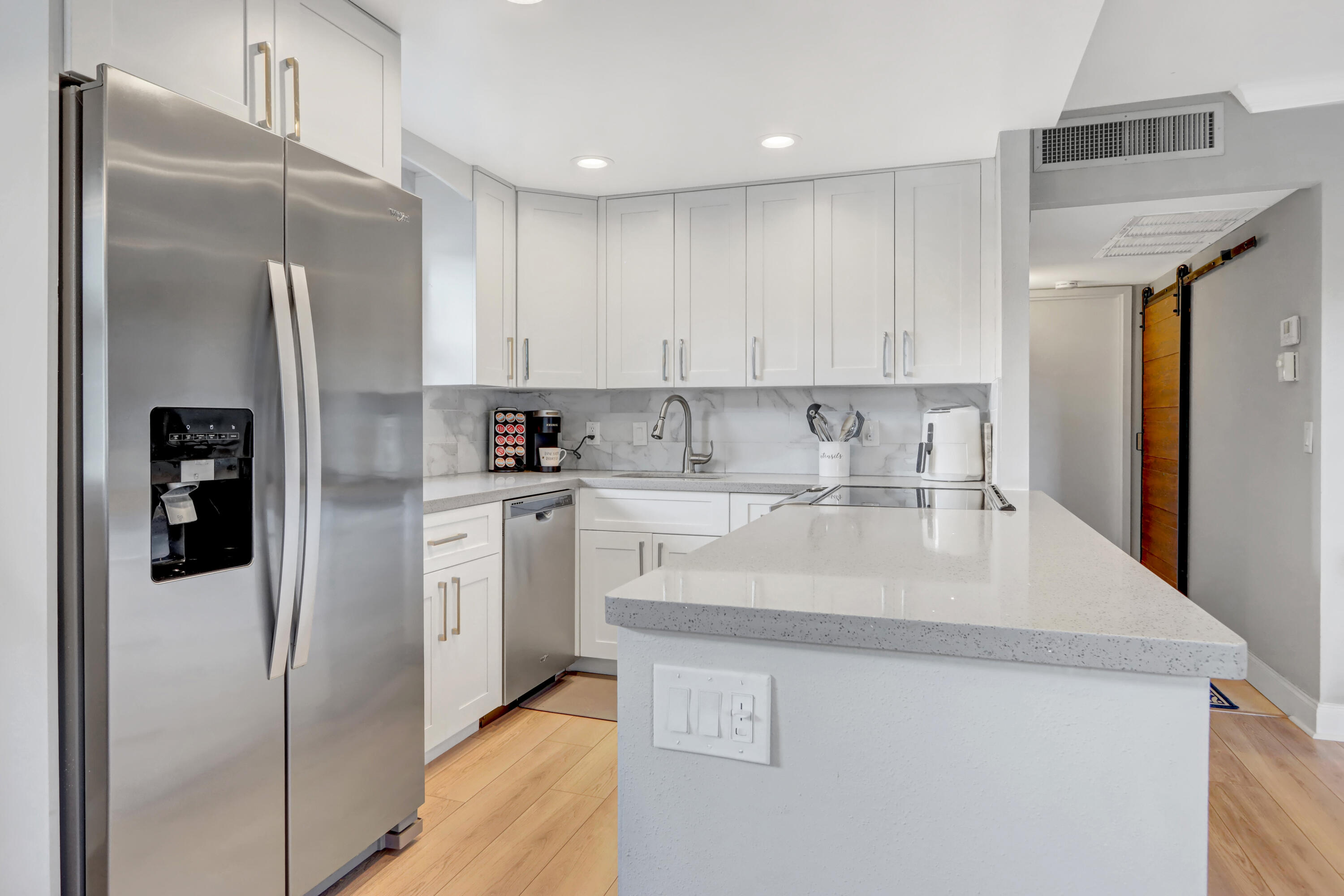 508 Monaco Way Delray Beach, FL 33446 - Photo 4 of 36 a kitchen with stainless steel appliances granite countertop a refrigerator sink and cabinets