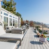 a view of roof deck with patio