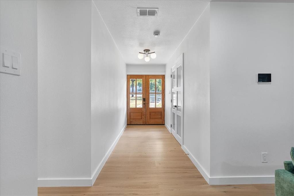 3509 West Sublett Road Arlington, TX 76017 - Photo 5 of 39 Light wood-finish flooring, white walls, and recessed lighting