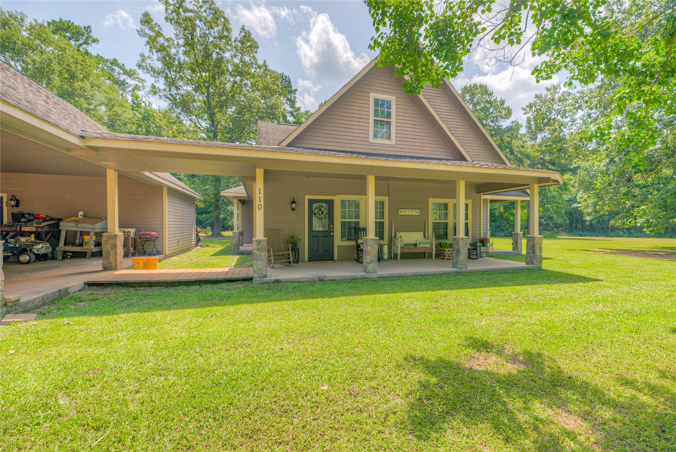 110 Happy Trails Road Coldspring, TX 77331 - Photo 36 of 49 Side of home with attached breezeway/walkway to keep you dry in the rain when getting in your vehicle