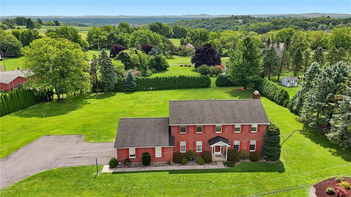 6090 Stone Post Road Bath, PA 18014 - Photo 45 of 57 Perched on a verdant lot, this substantial brick residence offers ample green space and expansive views.