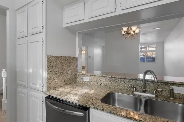 a kitchen with a refrigerator stove and microwave