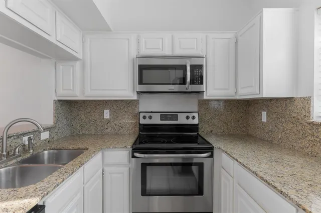 a close view of a sink and a faucet in a kitchen