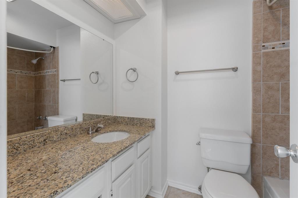6303 Prospect Avenue, Unit B104 Dallas, TX 75214 - Photo 19 of 36 Bathroom features granite counters and full tub with shower.