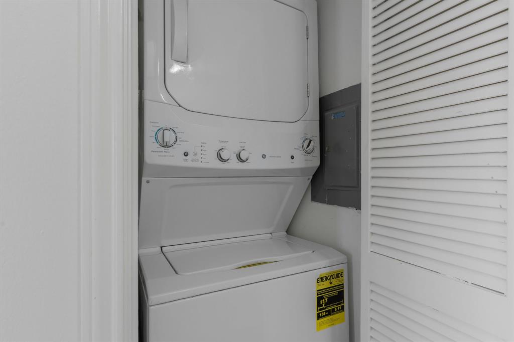 6303 Prospect Avenue, Unit B104 Dallas, TX 75214 - Photo 25 of 36 Laundry room featuring stacked washer / dryer