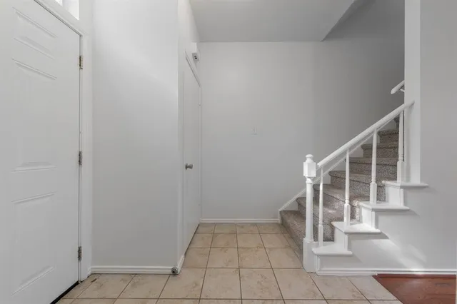a view of entryway and hall with a window