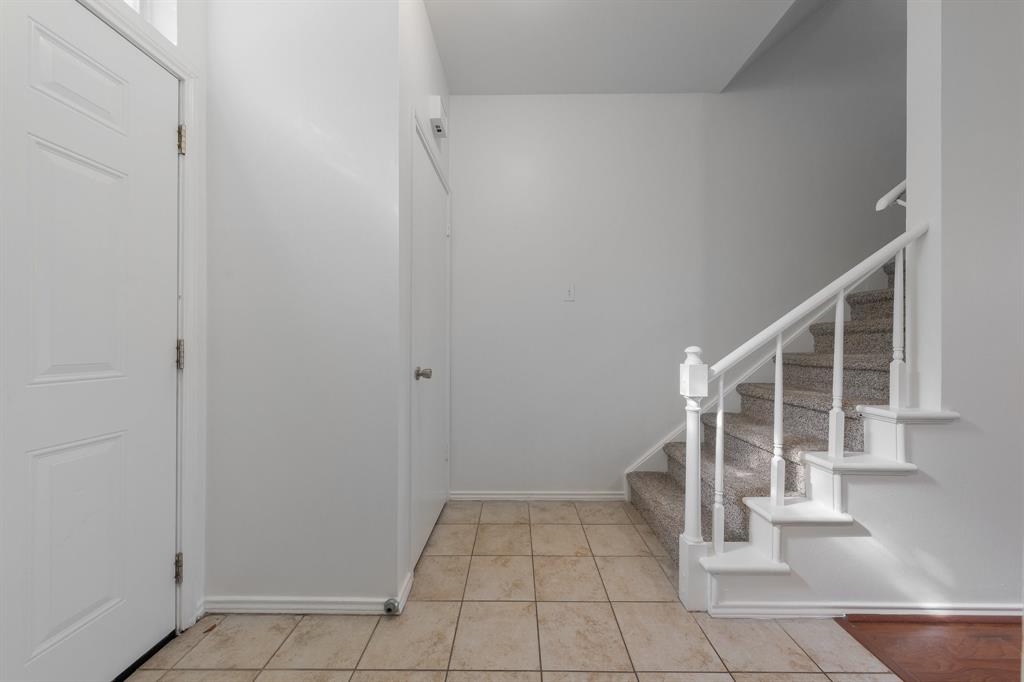 6303 Prospect Avenue, Unit B104 Dallas, TX 75214 - Photo 4 of 36 Foyer entrance featuring stairway