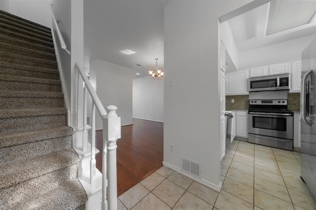 6303 Prospect Avenue, Unit B104 Dallas, TX 75214 - Photo 5 of 36 View from Foyer into kitchen and living room.