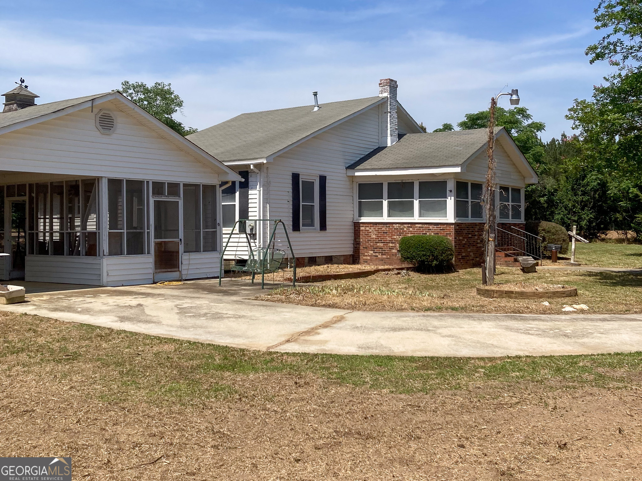 1300 Terry Drive Stapleton, GA 30823 - Photo 21 of 25 a view of a house with a patio and a yard