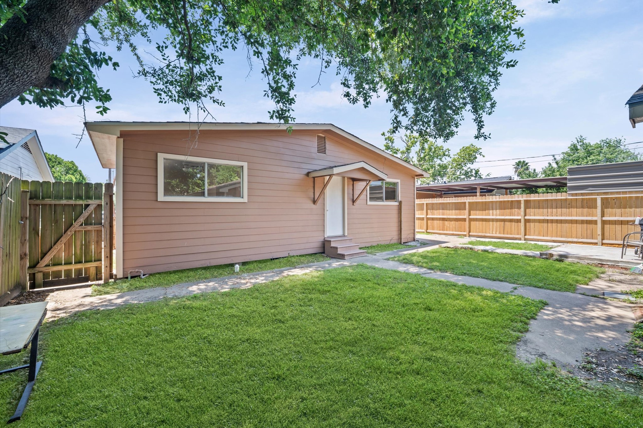 10621 Lane Street Houston, TX 77029 - Photo 22 of 29 a view of a backyard with a garden