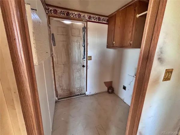 a view of a hallway with windows