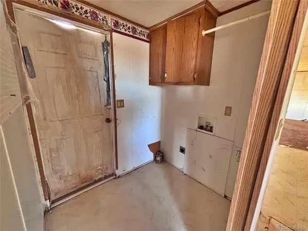a large kitchen with cabinets and a sink