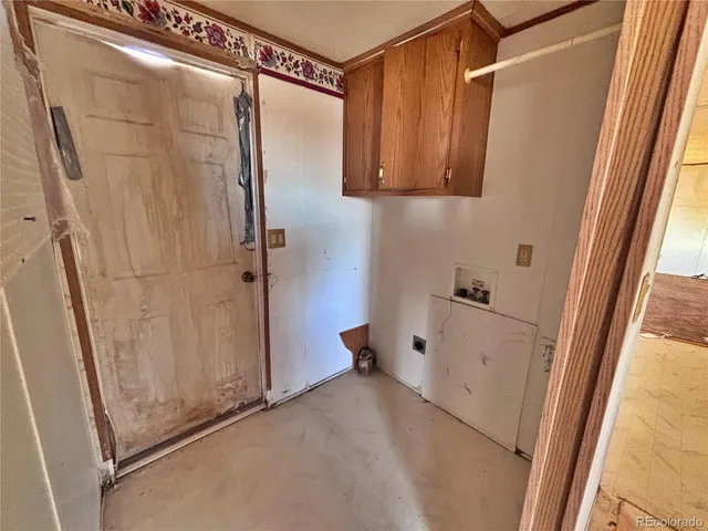 a large kitchen with cabinets and a sink