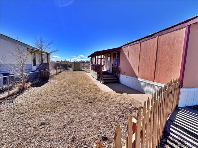 a view of a house with wooden stairs