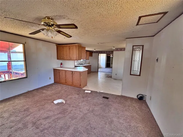 a view of a livingroom with furniture and window