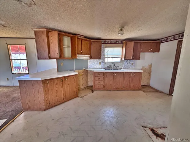 a large kitchen with a large window