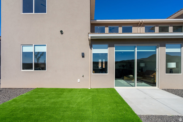 2972 West 570 North Hurricane, UT 84737 - Photo 87 of 104 Rear view of property featuring a lawn, stucco siding, and a patio