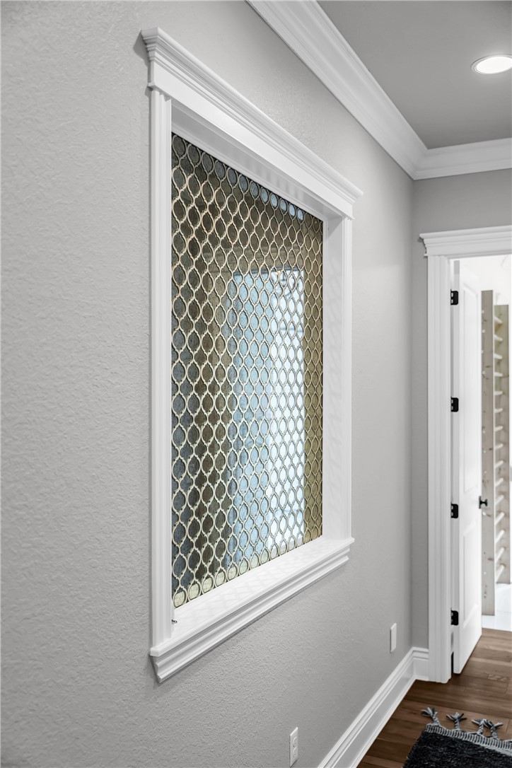 3510 Copper Ridge Road Rogers, AR 72756 - Photo 24 of 58 This interior space features light grey walls and a decorative window with a patterned privacy screen