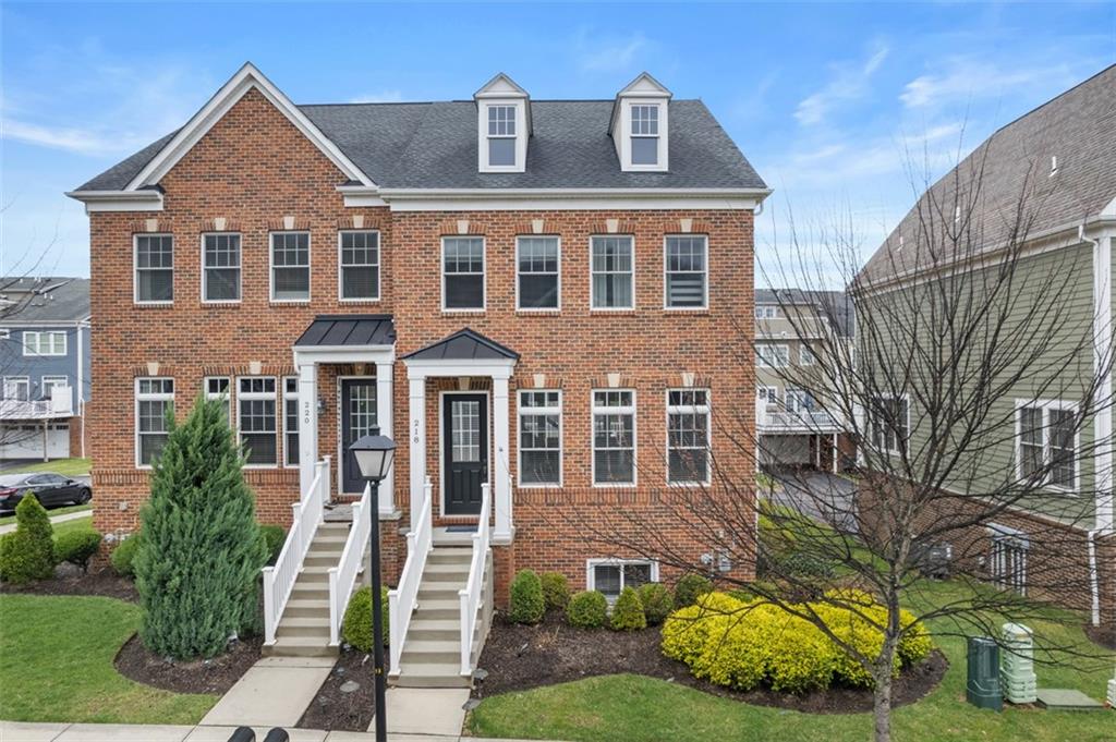 218 Venango Trail Mars, PA 16046 - Photo 1 of 42 front view of a house with a garden