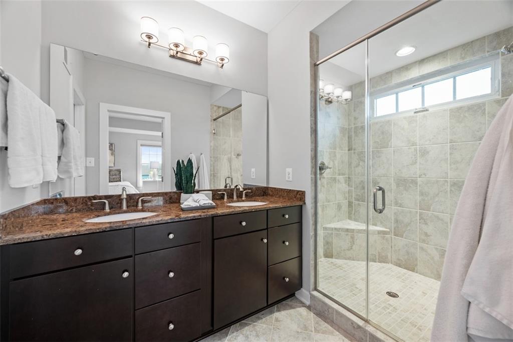 218 Venango Trail Mars, PA 16046 - Photo 19 of 42 a bathroom with a granite countertop sink mirror and shower